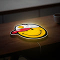 Smiley Face LED Light - Retro Backwards Cap Glow Sign, Fun Room Decor, Cheerful Gift with Vibrant Illumination
