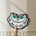 Unlit Alice in Wonderland Cheshire Cat LED lightbox held by hand to show size and details