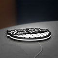 Alice in Wonderland Cheshire Cat LED lightbox lying flat on a desk with white glow