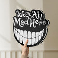 Unlit Alice in Wonderland Cheshire Cat LED lightbox held by hand to show size and details