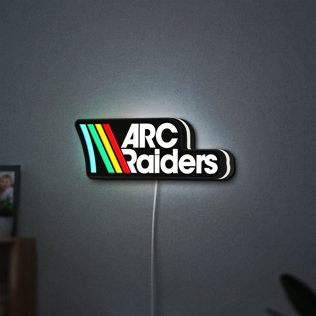 ARC Raiders Sci-Fi Looter Shooter LED lightbox hanging on a wall with white glow