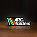 Front view of ARC Raiders Sci-Fi Looter Shooter LED lightbox sign glowing on a wooden desk