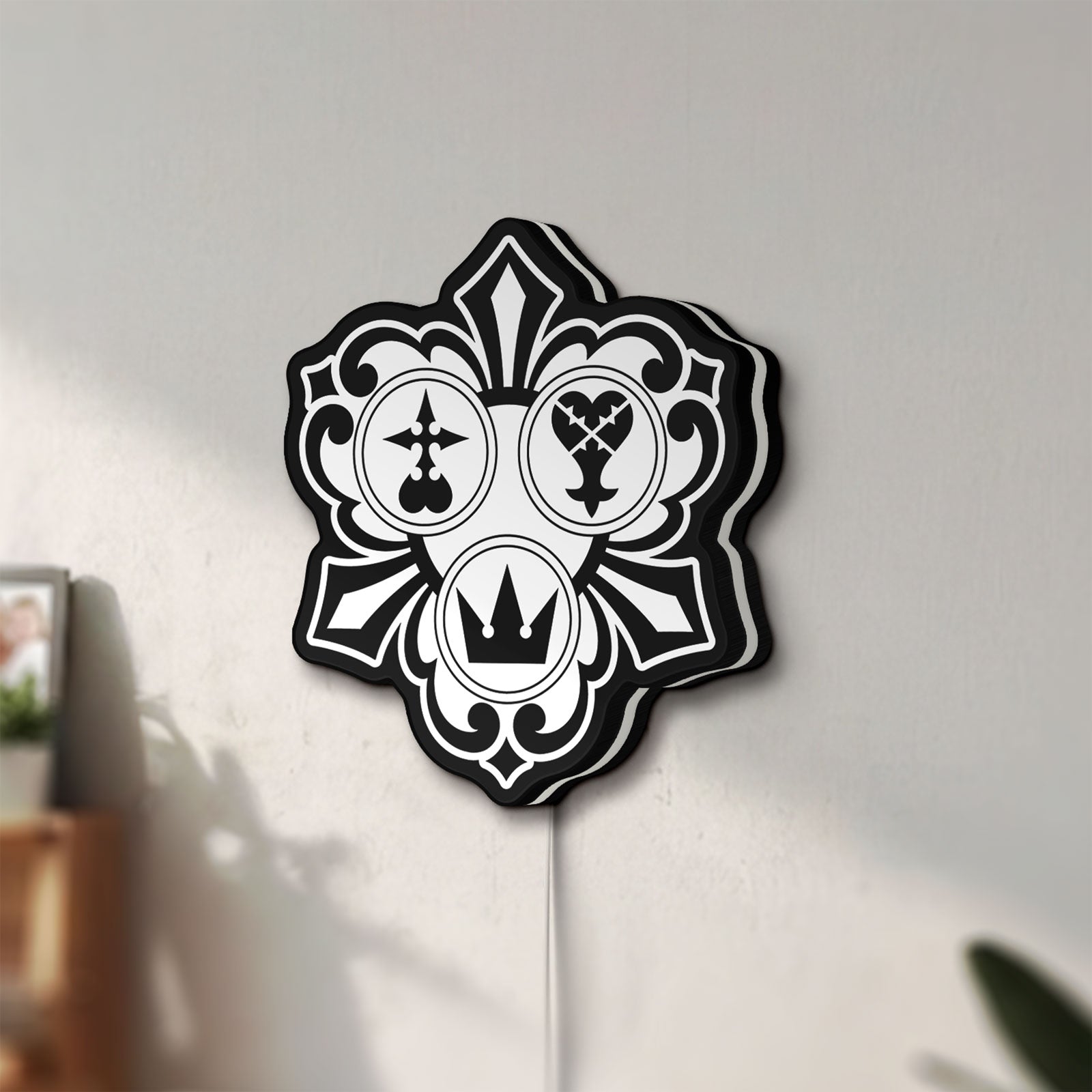Unlit Kingdom Hearts Keyblade Sora Crown LED lightbox mounted on a wall in daylight