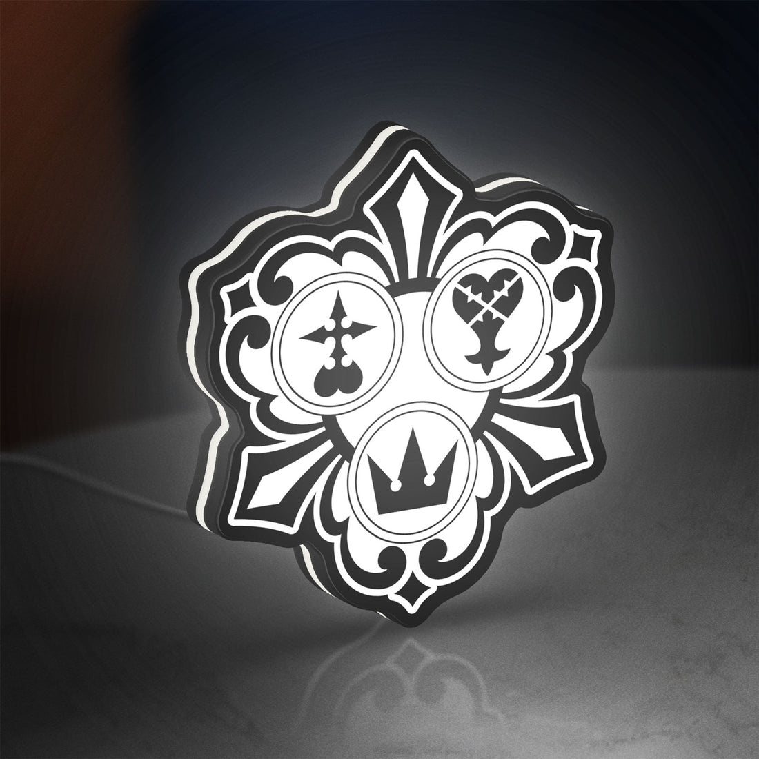 Kingdom Hearts Keyblade Sora Crown LED lightbox hanging on a wall with white glow