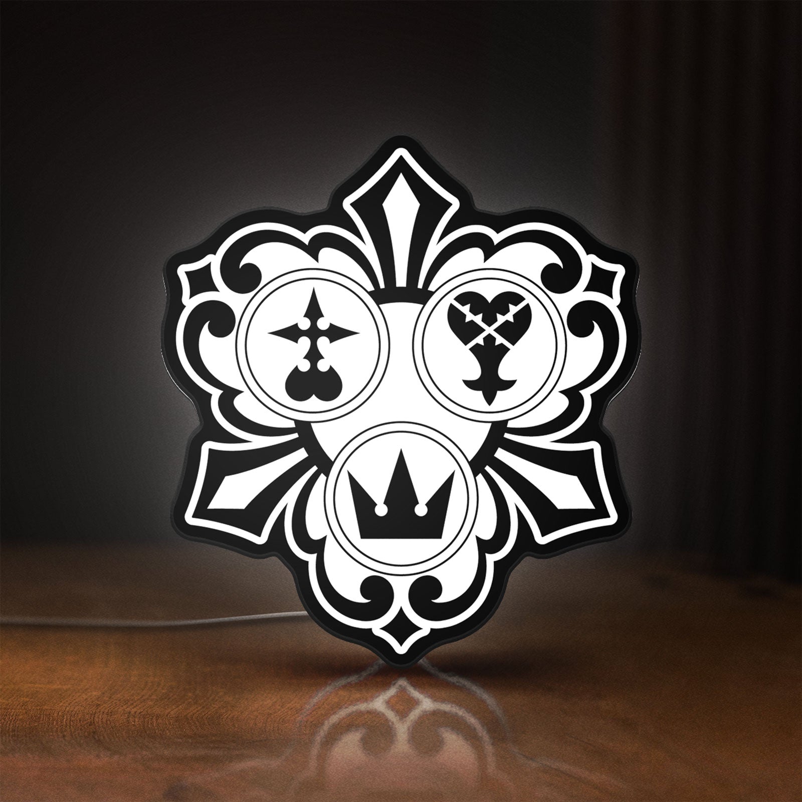 Front view of Kingdom Hearts Keyblade Sora Crown LED lightbox sign glowing on a wooden desk