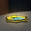 Final Fantasy Black Mage Retro RPG LED lightbox lying flat on a desk with yellow glow