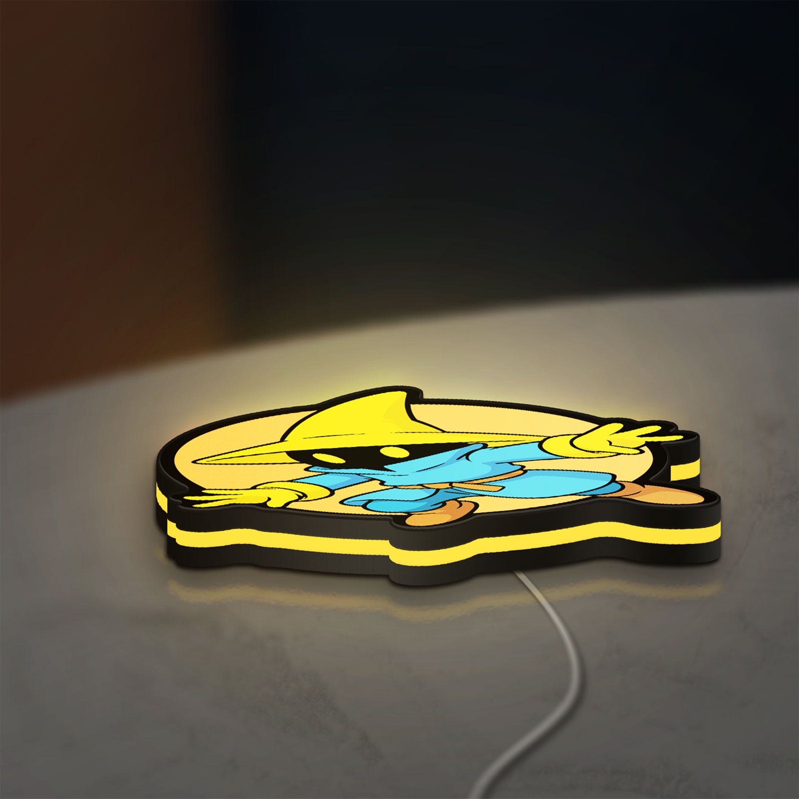 Final Fantasy Black Mage Retro RPG LED lightbox lying flat on a desk with yellow glow