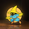 Front view of Final Fantasy Black Mage Retro RPG LED lightbox sign glowing on a wooden desk
