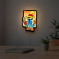 Final Fantasy Black Mage Retro RPG LED lightbox hanging on a room wall with soft yellow light