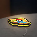 Final Fantasy Black Mage Retro RPG LED lightbox lying flat on a desk with yellow glow