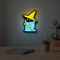 Final Fantasy Black Mage Retro RPG LED lightbox hanging on a room wall with soft yellow light