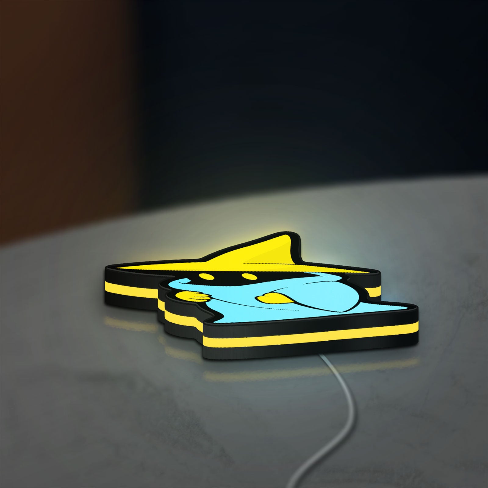 Final Fantasy Black Mage Retro RPG LED lightbox lying flat on a desk with yellow glow