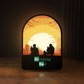 Front view of Breaking Bad Heisenberg Walter White LED lightbox sign glowing on a wooden desk