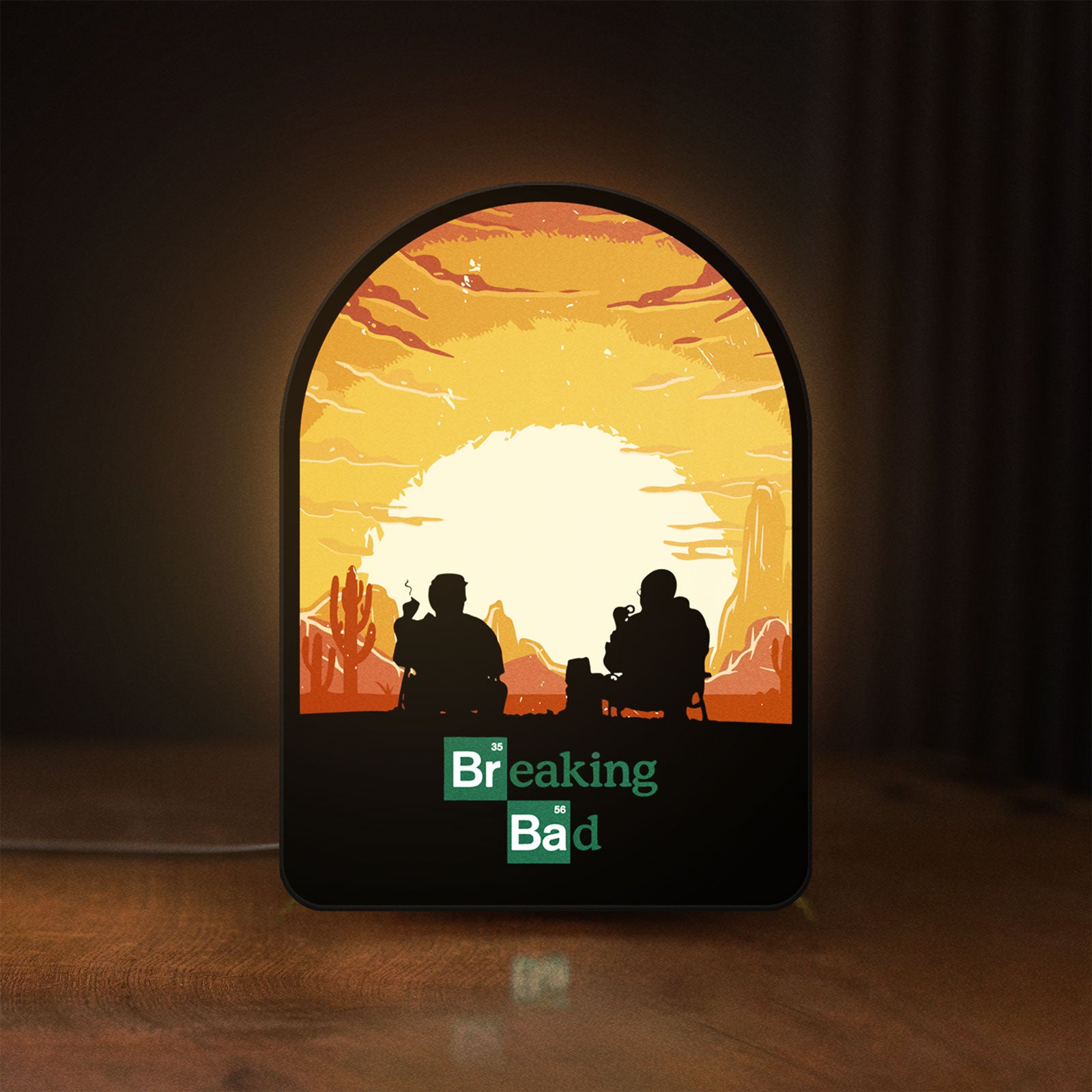 Front view of Breaking Bad Heisenberg Walter White LED lightbox sign glowing on a wooden desk
