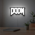 DOOM Slayer Space Marine Retro FPS LED lightbox hanging on a room wall with soft white light