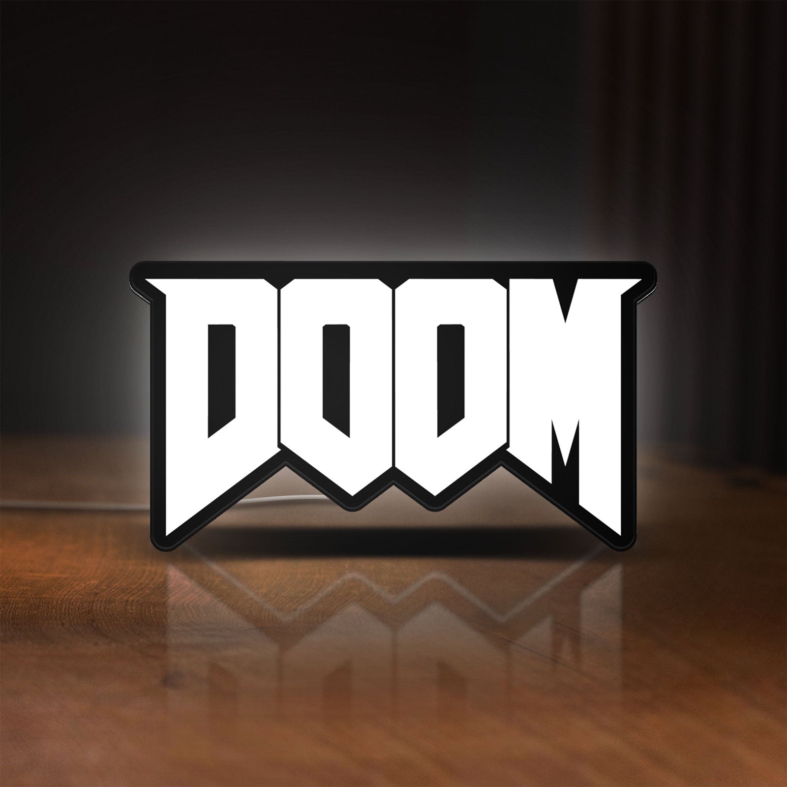 Front view of DOOM Slayer Space Marine Retro FPS LED lightbox sign glowing on a wooden desk