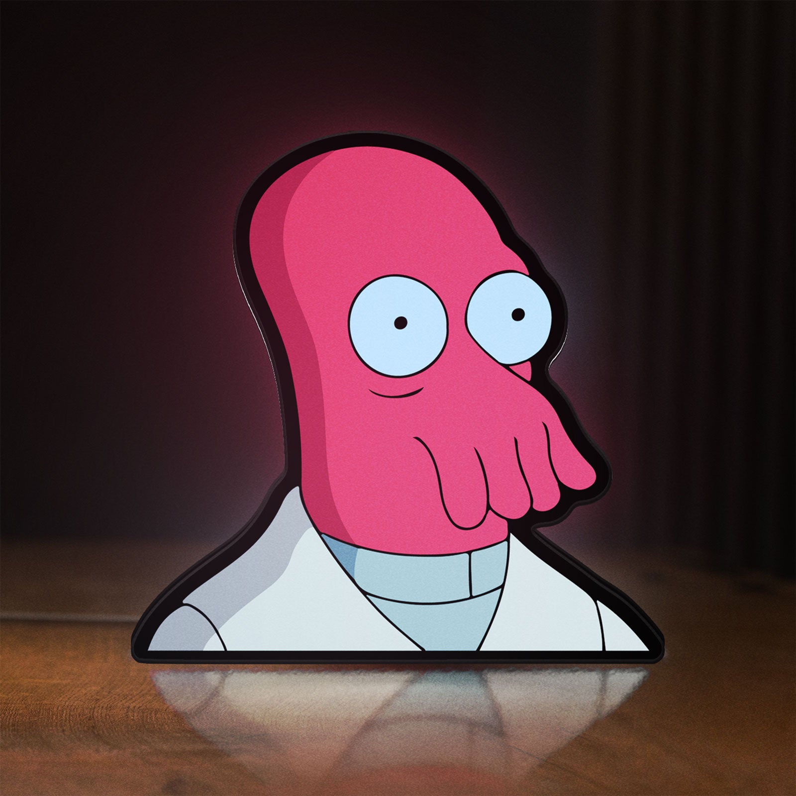 Front view of Futurama Doctor Zoidberg Comedy LED lightbox sign glowing on a wooden desk