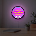 Fallout Nuka Cola Quantum RPG LED lightbox hanging on a room wall with soft purple light