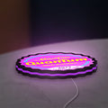 Fallout Nuka Cola Quantum RPG LED lightbox lying flat on a desk with purple glow