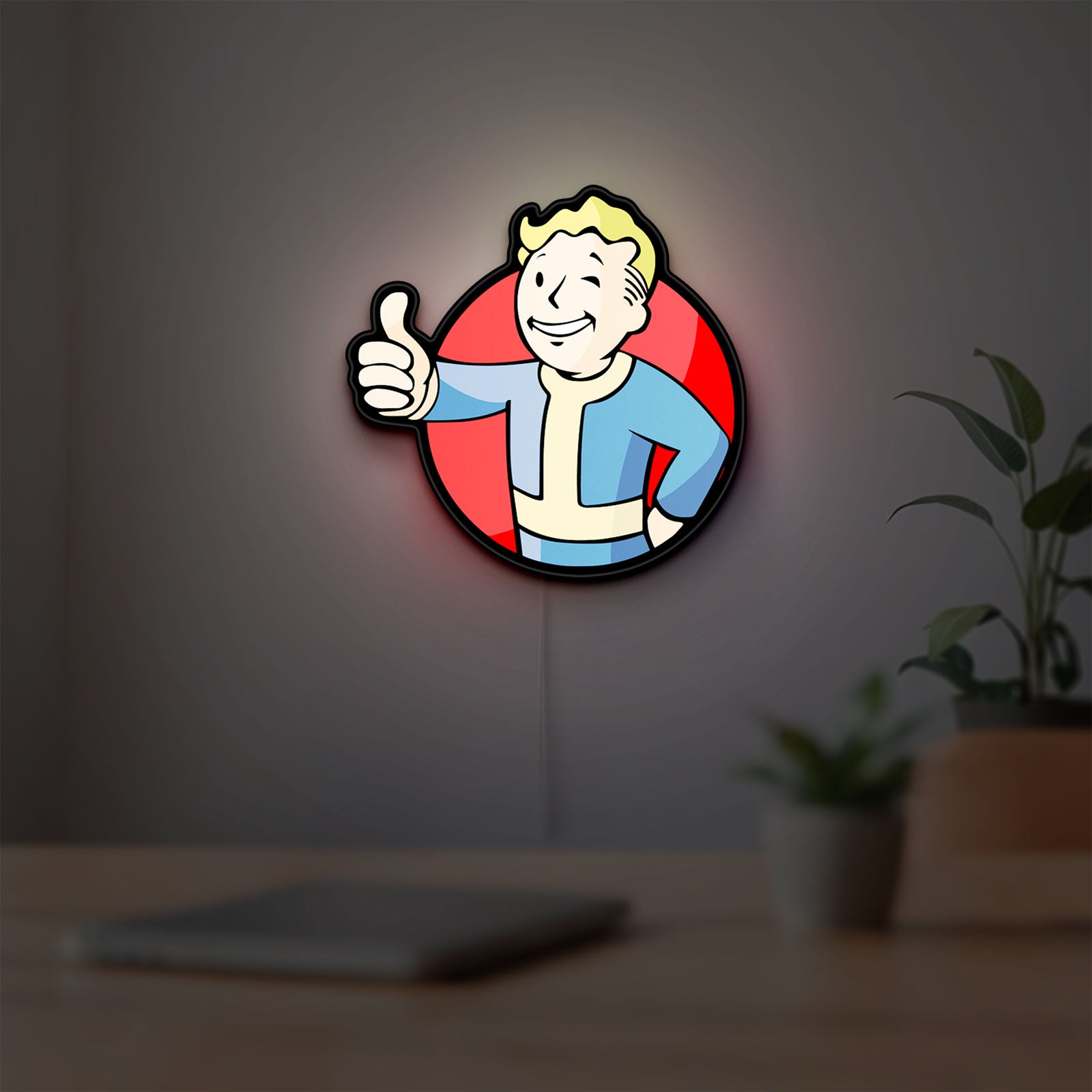 Fallout Vault Boy Thumbs Up Mascot LED lightbox hanging on a room wall with soft red light