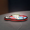 Fallout Vault Boy Thumbs Up Mascot LED lightbox lying flat on a desk with red glow