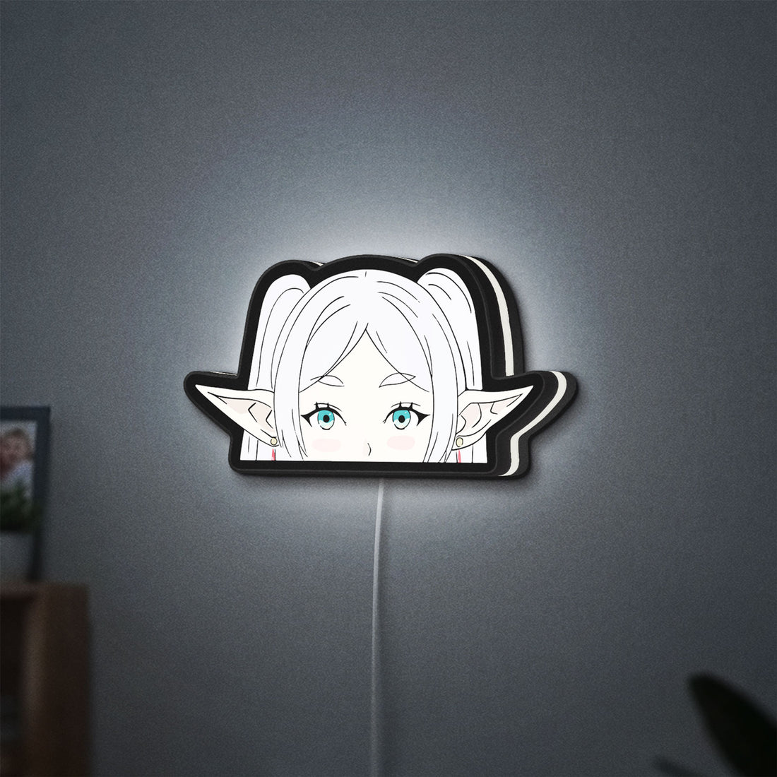 Frieren Beyond Journeys End Elf LED lightbox hanging on a wall with white glow