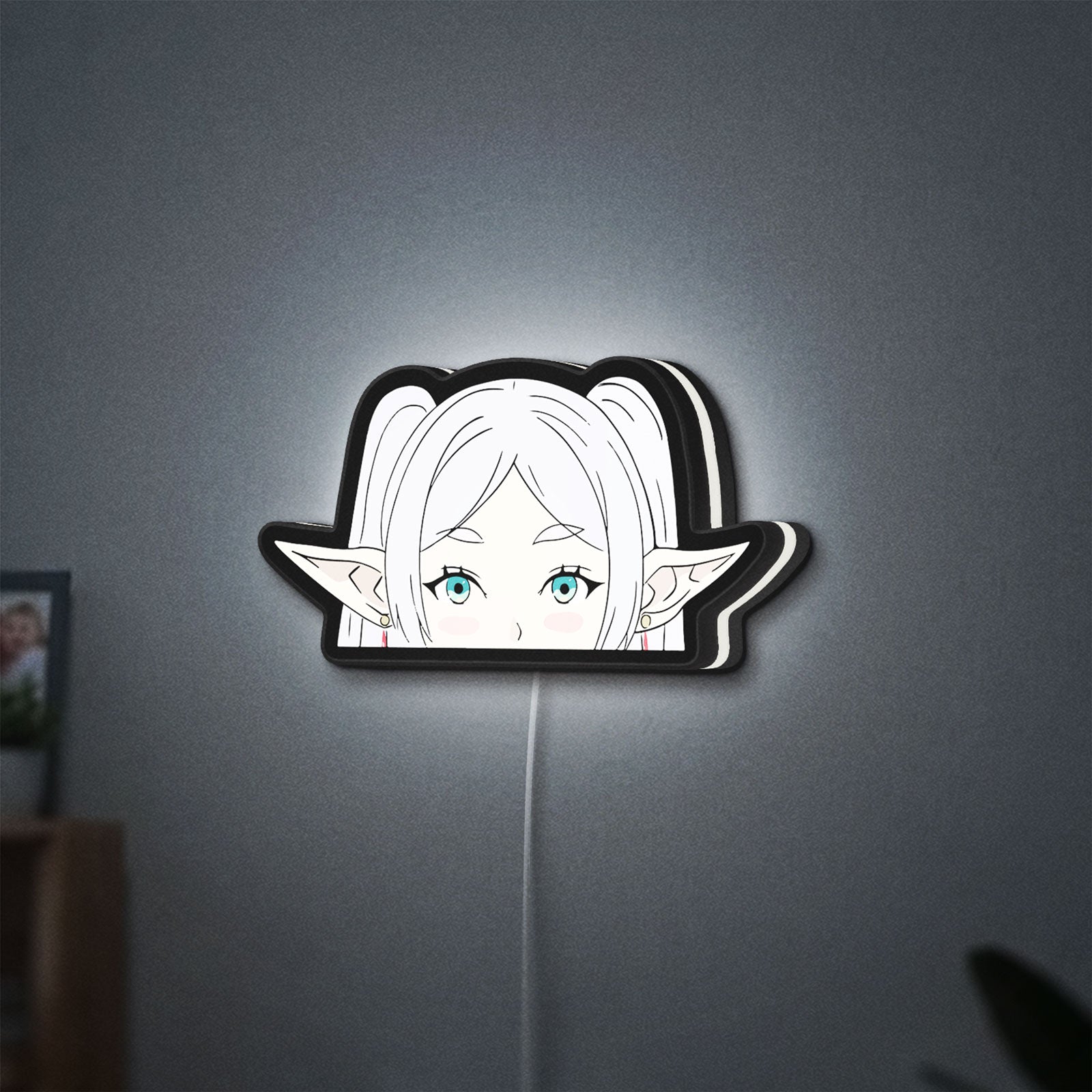 Frieren Beyond Journeys End Elf LED lightbox hanging on a wall with white glow