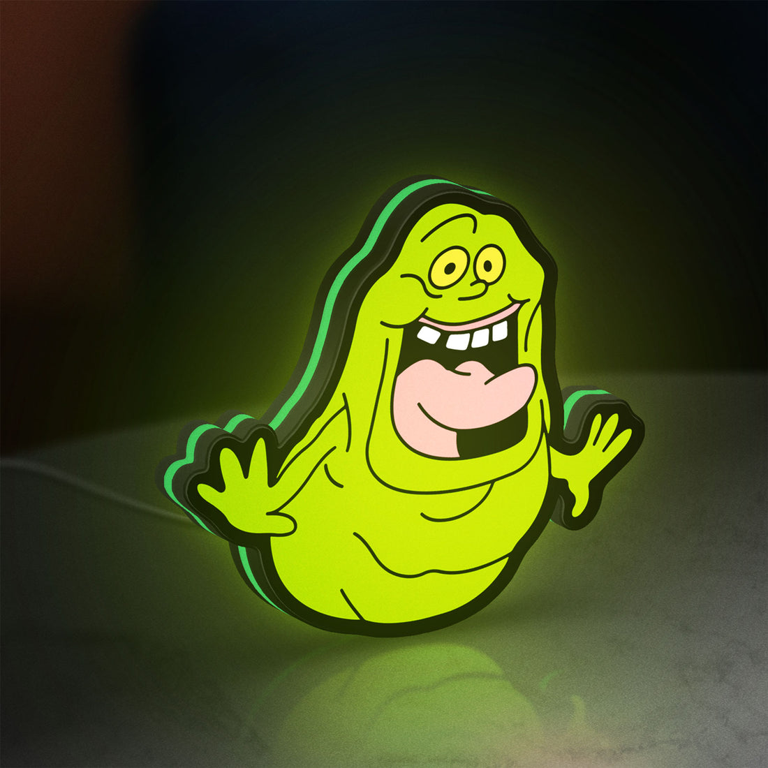 Ghostbusters Slimer 80s Movie LED lightbox hanging on a wall with green glow