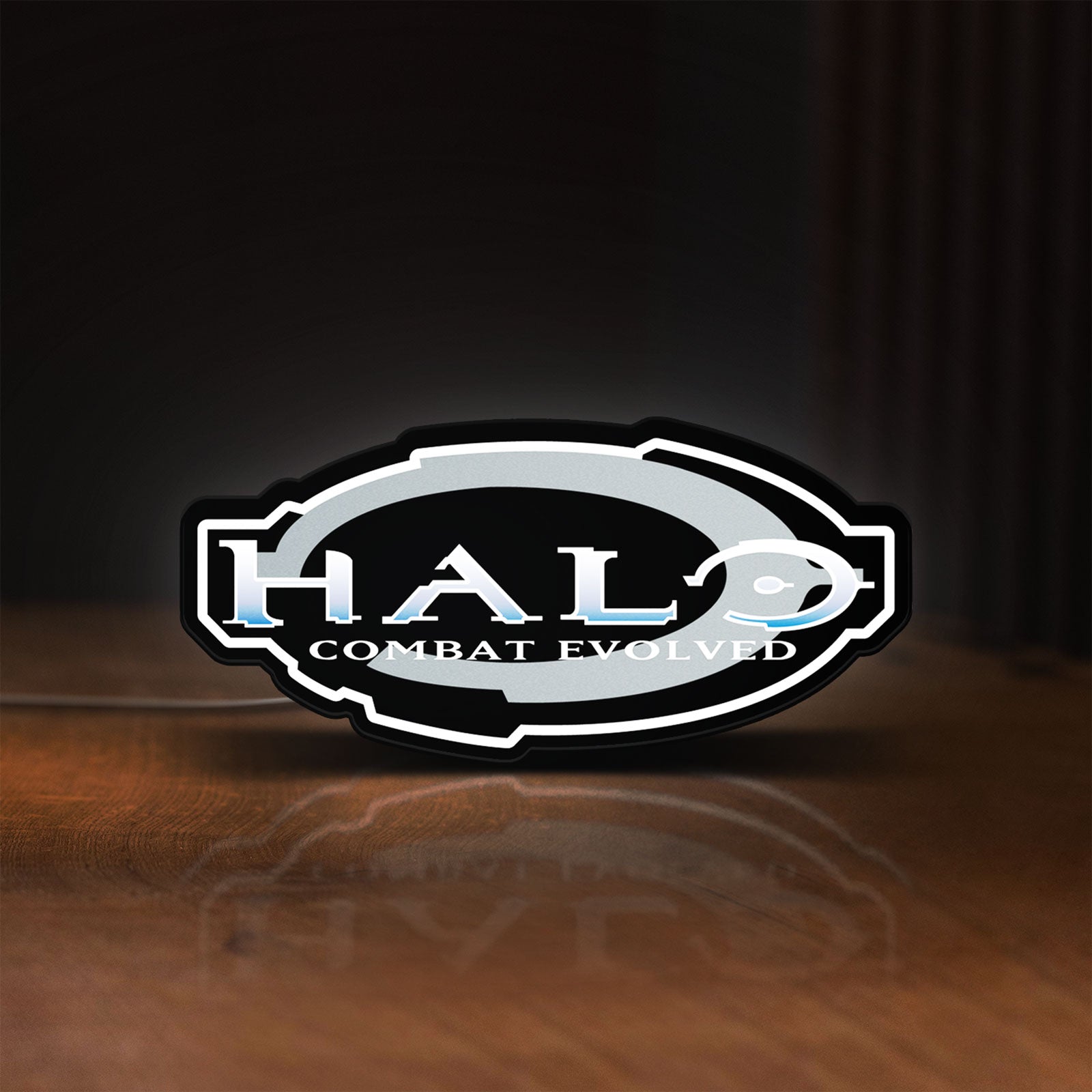Front view of Halo Master Chief Xbox FPS Gamer LED lightbox sign glowing on a wooden desk