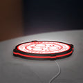 Silent Hill Halo of the Sun Horror LED lightbox lying flat on a desk with white and red glow