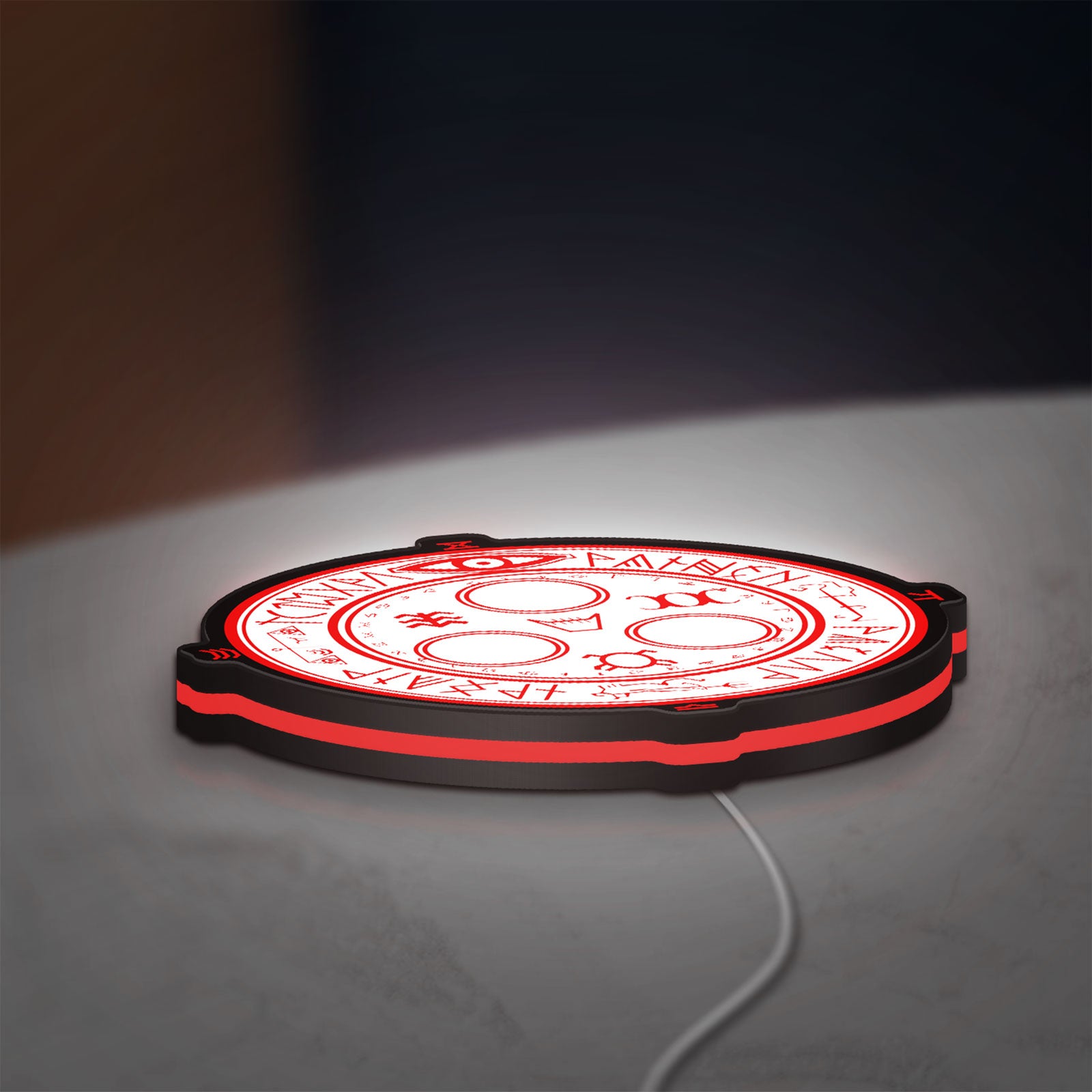 Silent Hill Halo of the Sun Horror LED lightbox lying flat on a desk with white and red glow