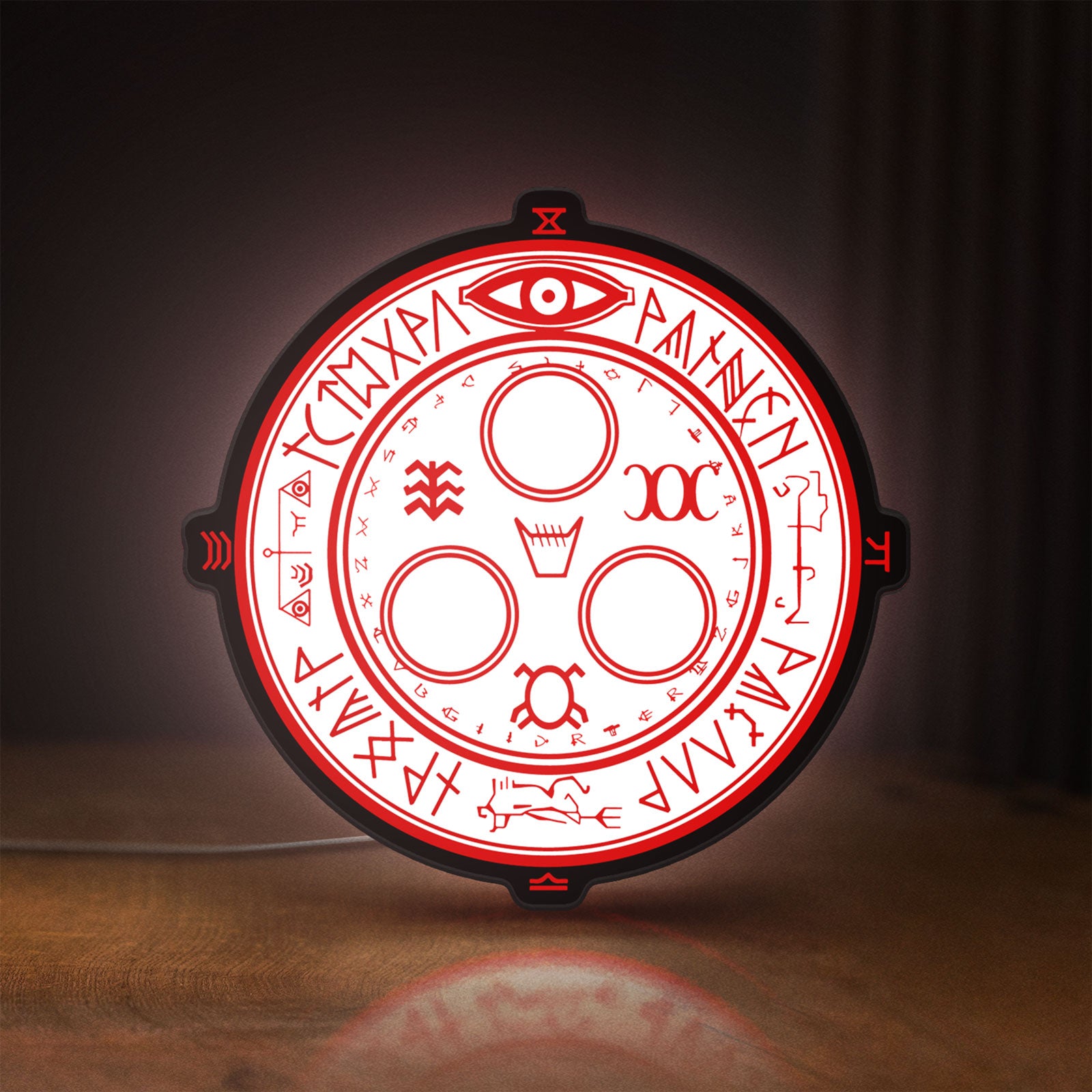 Front view of Silent Hill Halo of the Sun Horror LED lightbox sign glowing on a wooden desk