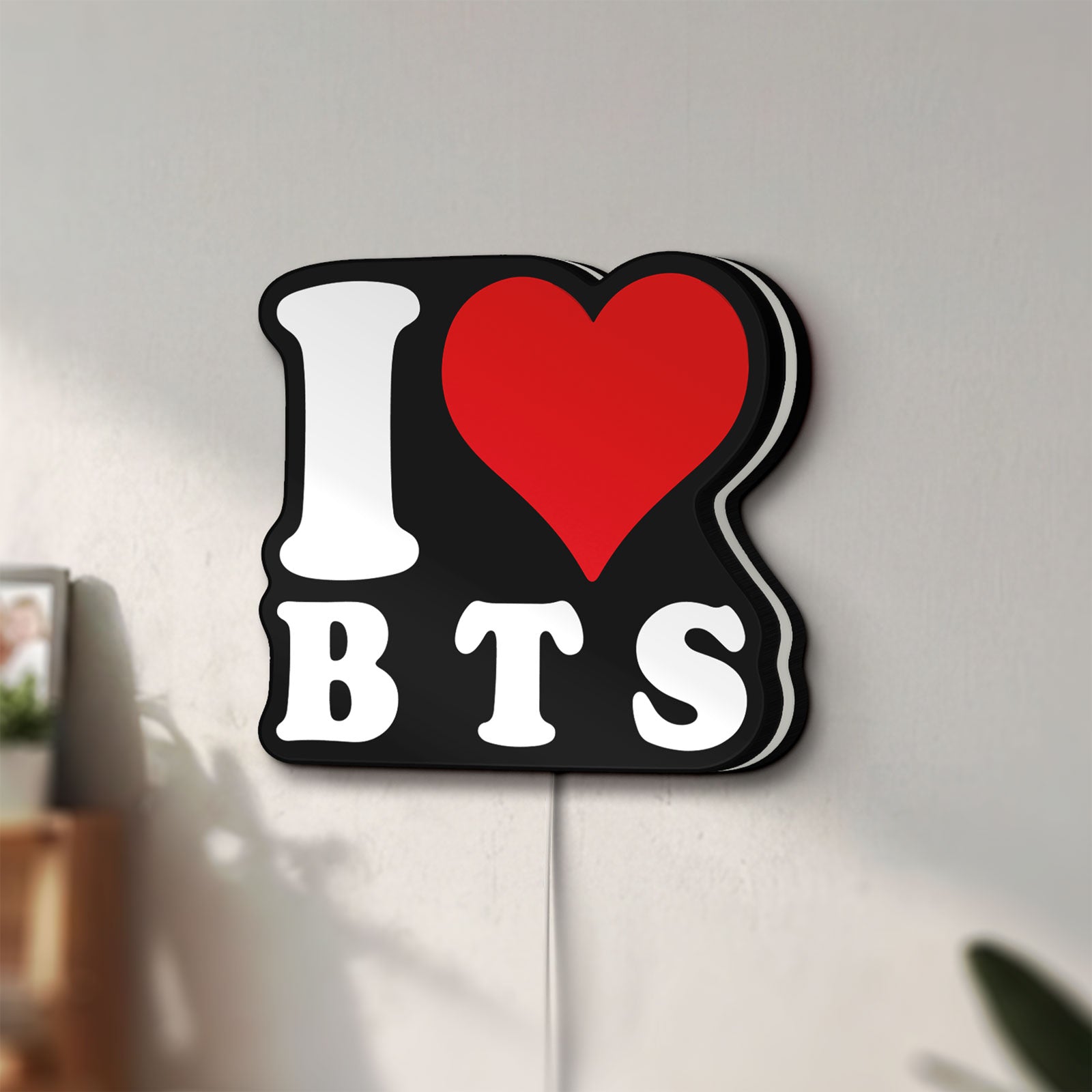 Unlit I love BT LED lightbox mounted on a wall in daylight