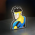 Invincible Title Logo Superhero LED lightbox standing on a desk from an angled side view with white glow
