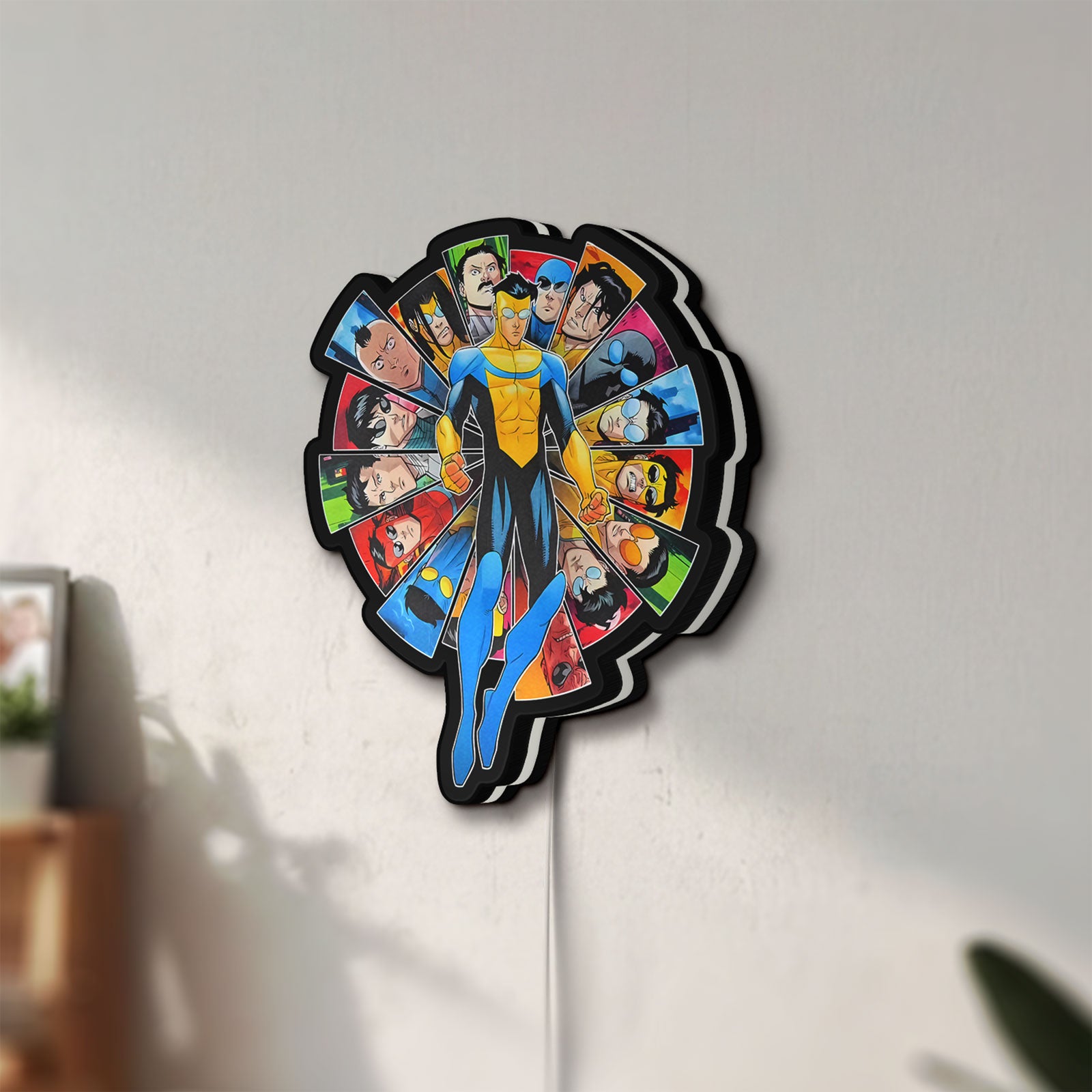 Unlit Invincible Title Logo Superhero LED lightbox mounted on a wall in daylight