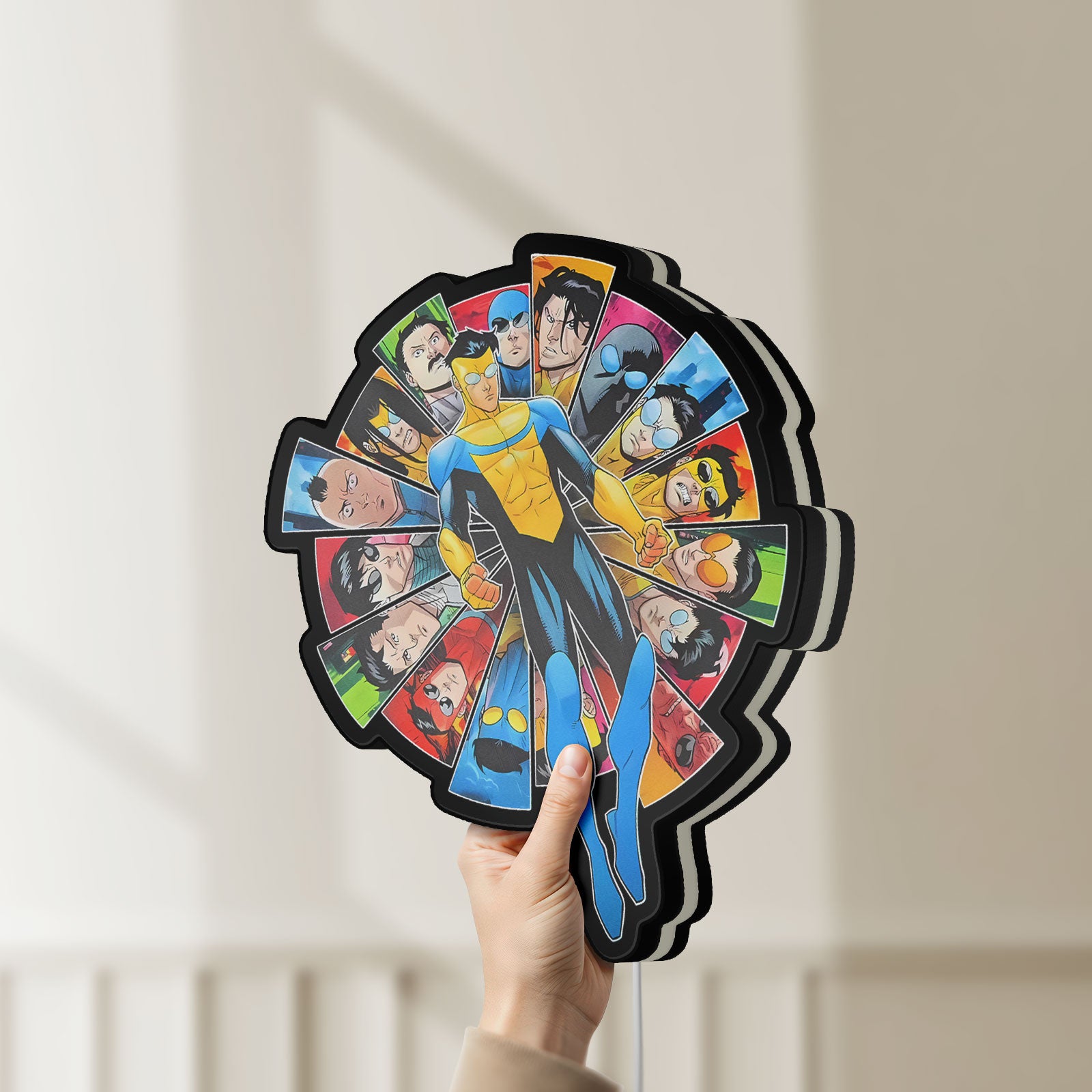 Unlit Invincible Title Logo Superhero LED lightbox held by hand to show size and details