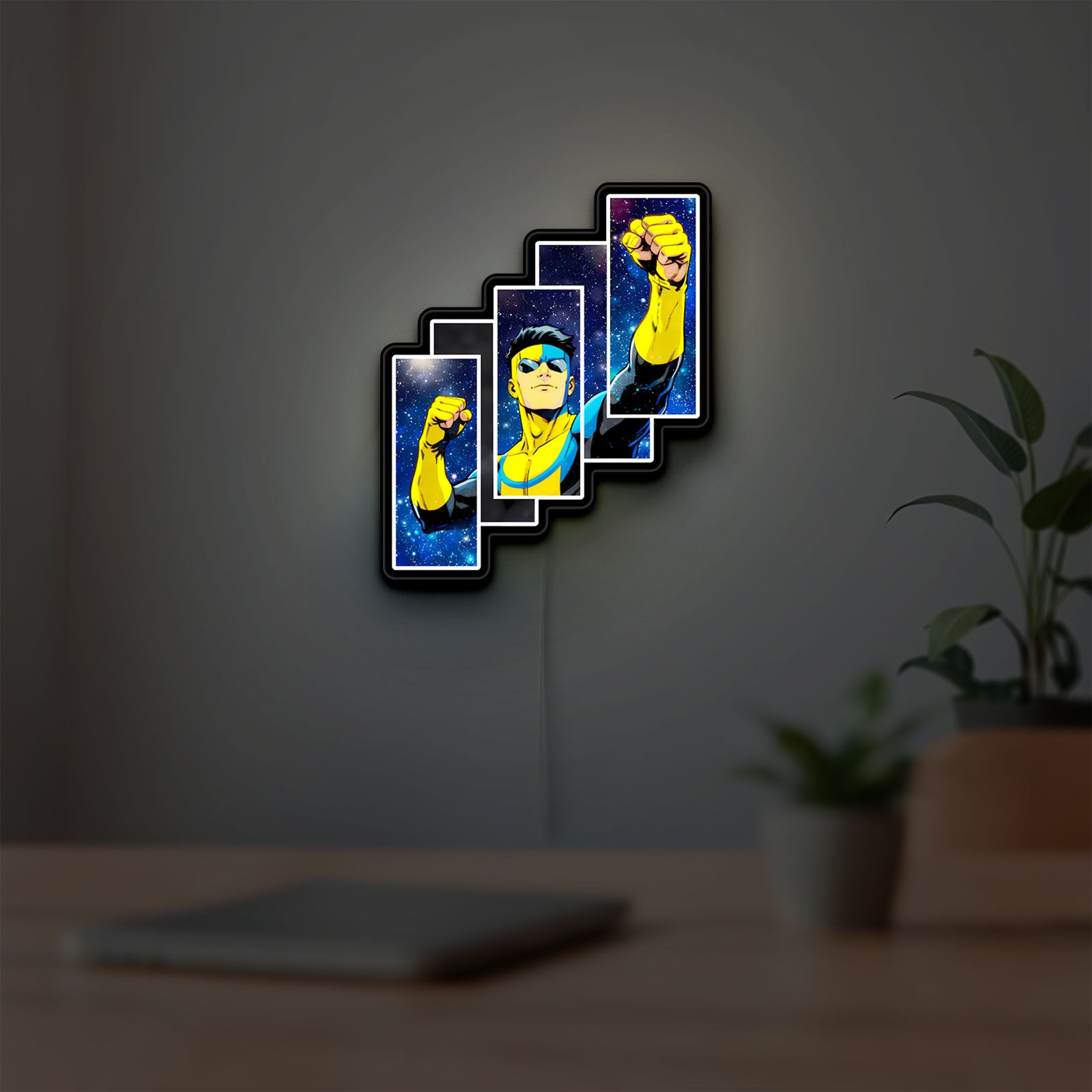 Invincible Title Logo Superhero LED lightbox hanging on a room wall with soft blue light