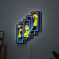 Invincible Title Logo Superhero LED lightbox hanging on a wall with blue glow