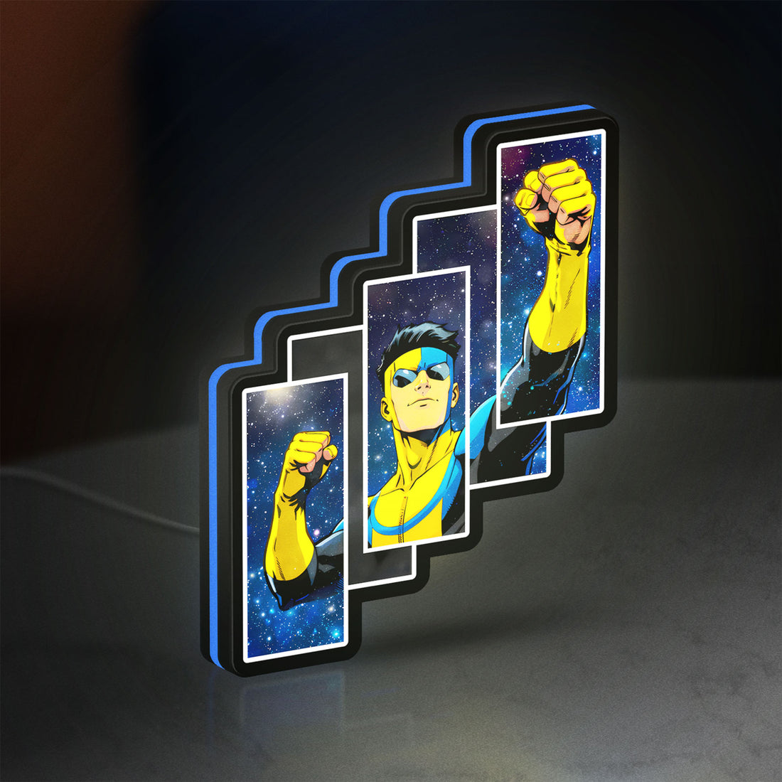 Invincible Title Logo Superhero LED lightbox hanging on a wall with blue glow