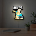 Invincible Think Mark Think Meme LED lightbox hanging on a room wall with soft yellow light