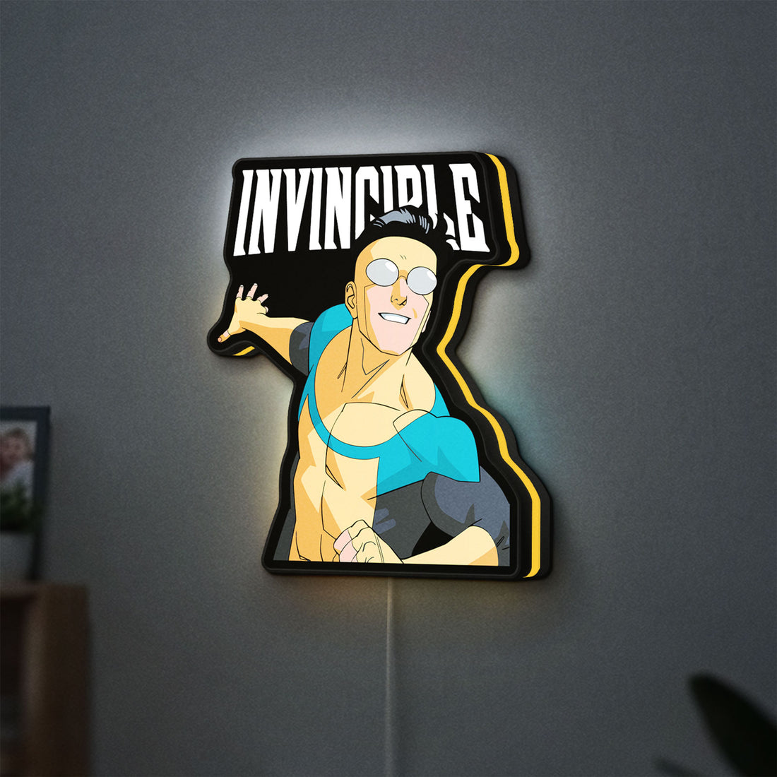 Invincible Think Mark Think Meme LED lightbox hanging on a wall with yellow glow