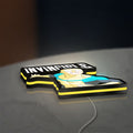 Invincible Think Mark Think Meme LED lightbox lying flat on a desk with yellow glow