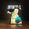 Front view of Invincible Think Mark Think Meme LED lightbox sign glowing on a wooden desk
