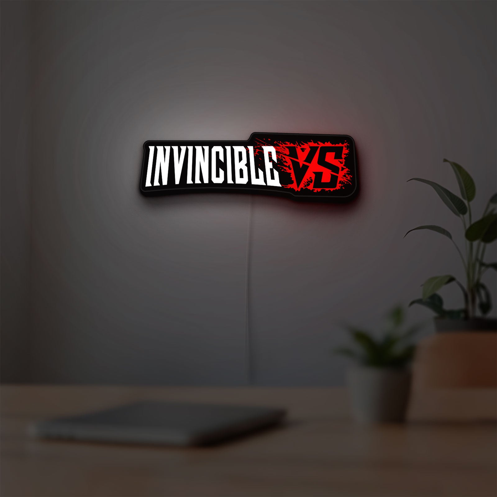 Invincible V Logo Mark Grayson LED lightbox hanging on a room wall with soft white light