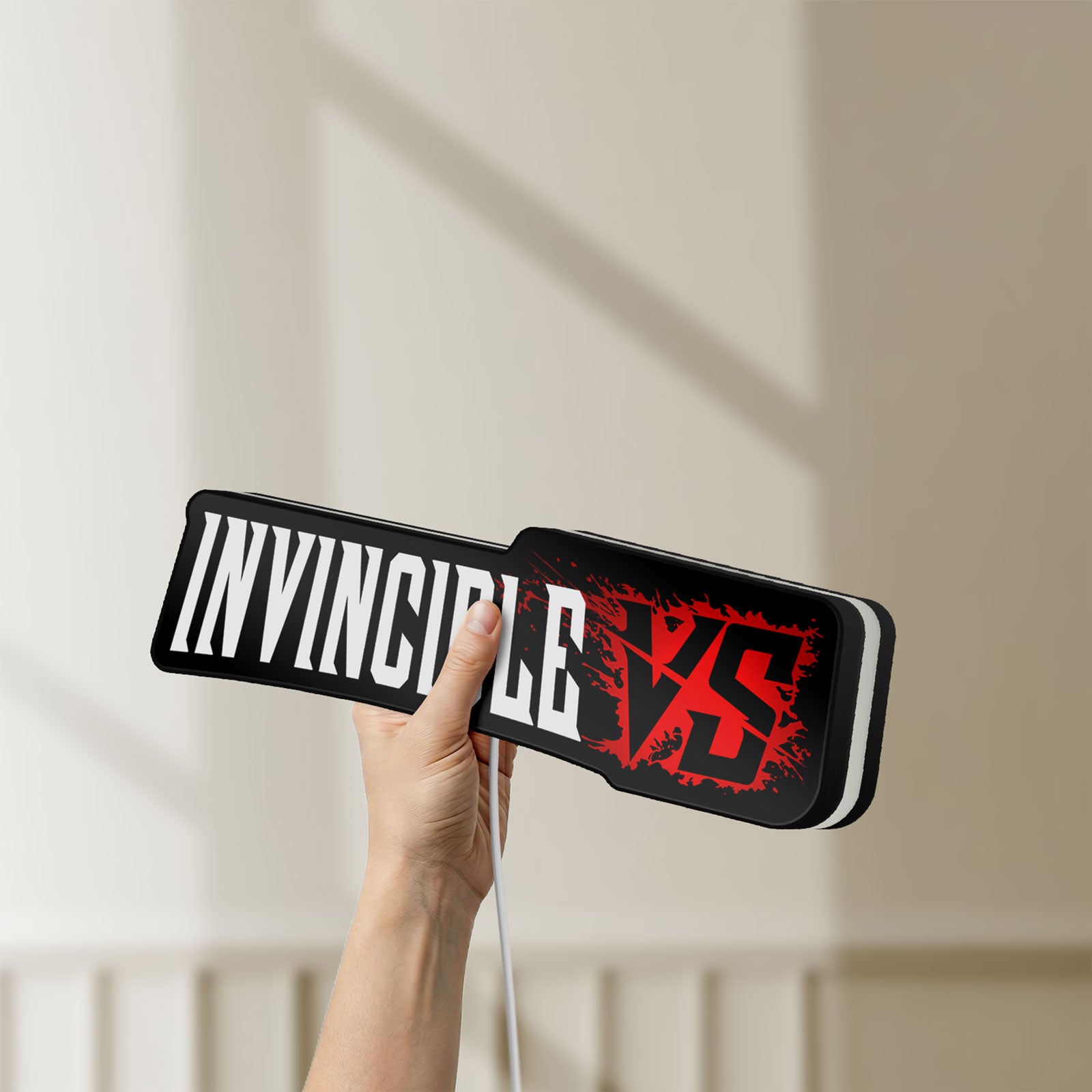 Unlit Invincible V Logo Mark Grayson LED lightbox held by hand to show size and details