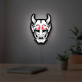 Cyberpunk Japanese Oni Mask Demon LED lightbox hanging on a room wall with soft white light