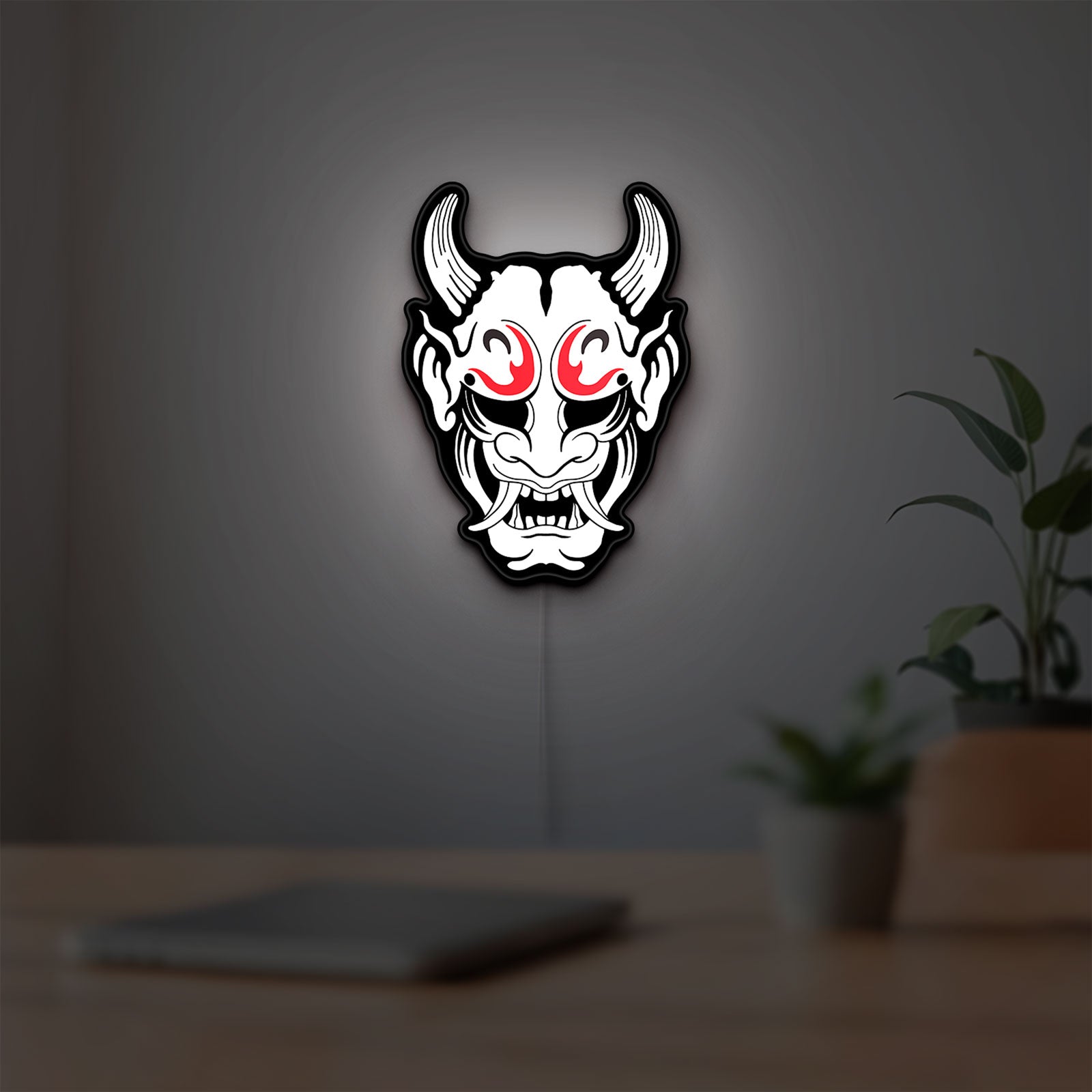 Cyberpunk Japanese Oni Mask Demon LED lightbox hanging on a room wall with soft white light