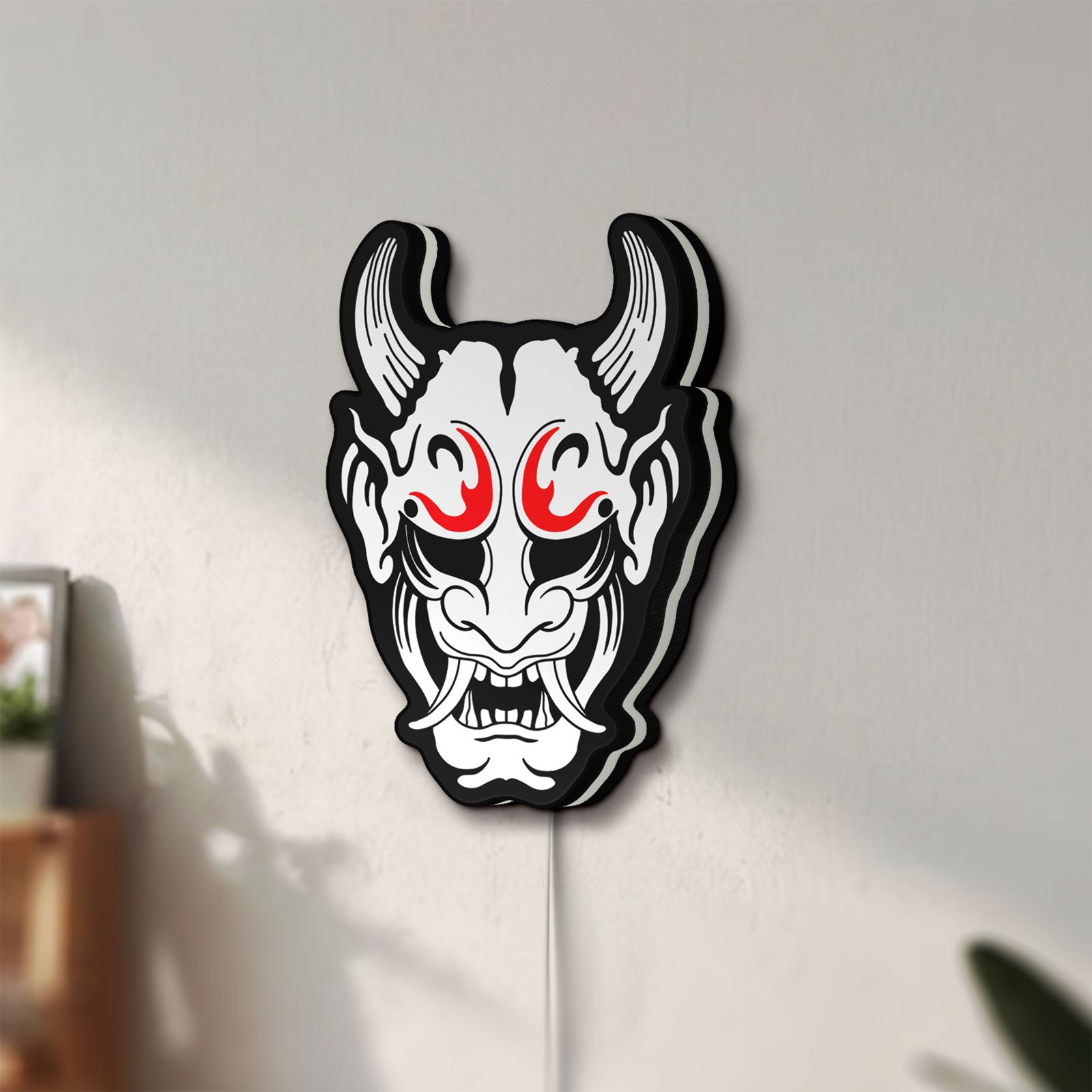 Unlit Cyberpunk Japanese Oni Mask Demon LED lightbox mounted on a wall in daylight