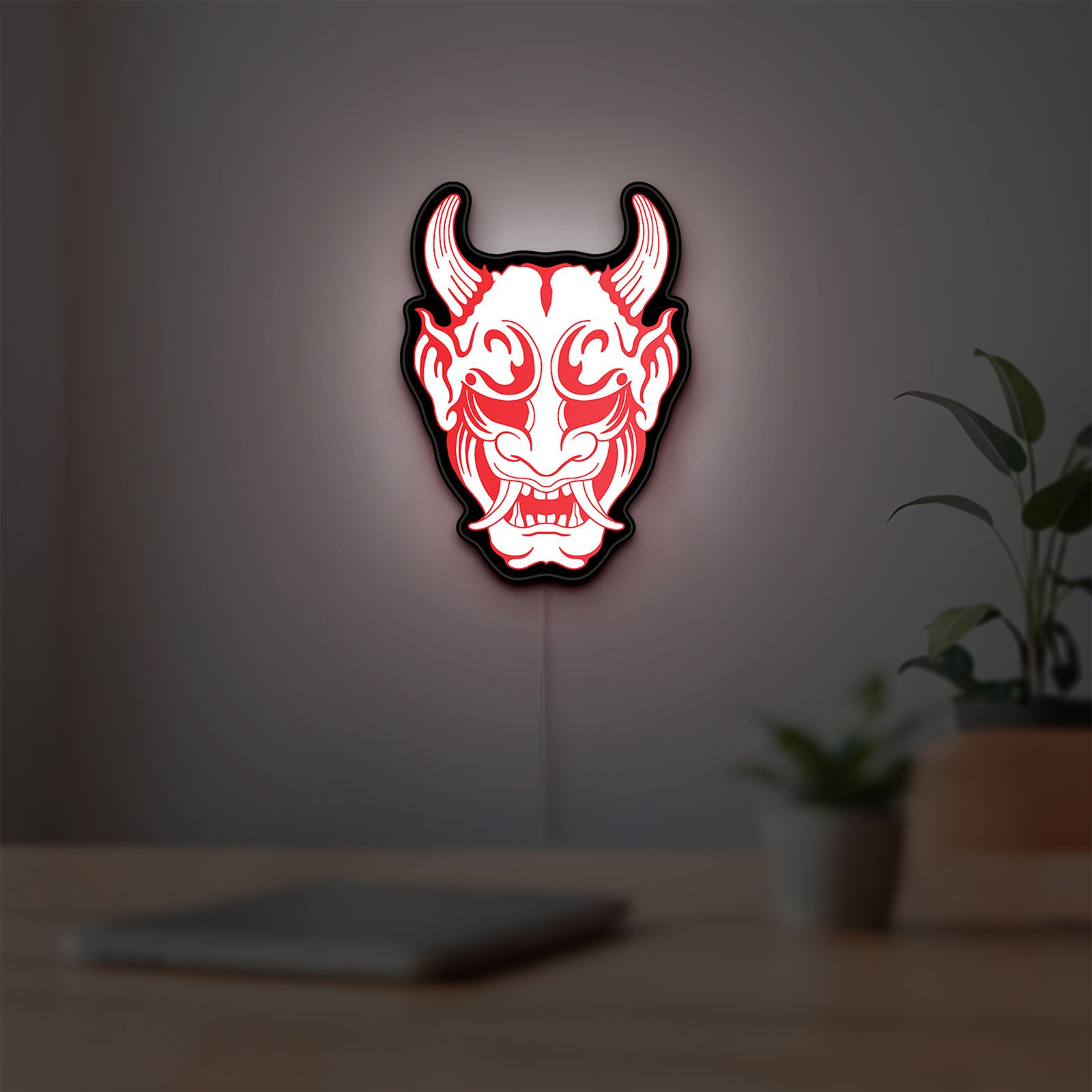 Cyberpunk Japanese Oni Mask Demon LED lightbox hanging on a room wall with soft red light