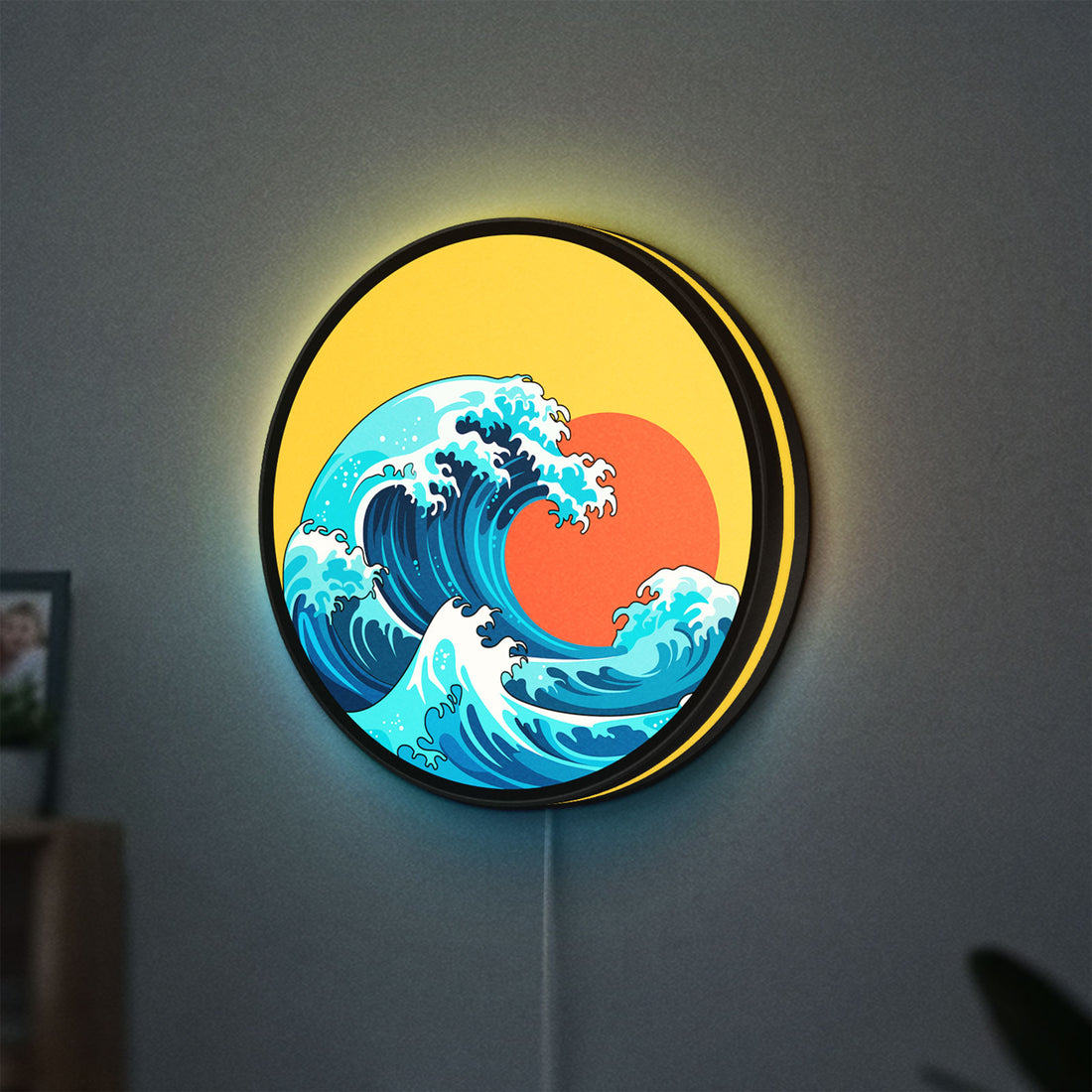 Great Wave off Kanagawa Ocean Art LED lightbox hanging on a wall with yellow glow
